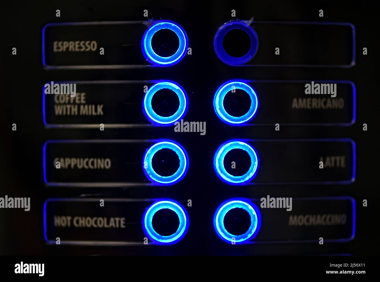 I pulsanti di una macchina da caffè indicano il tipo di bevanda blu chiaro Foto Stock