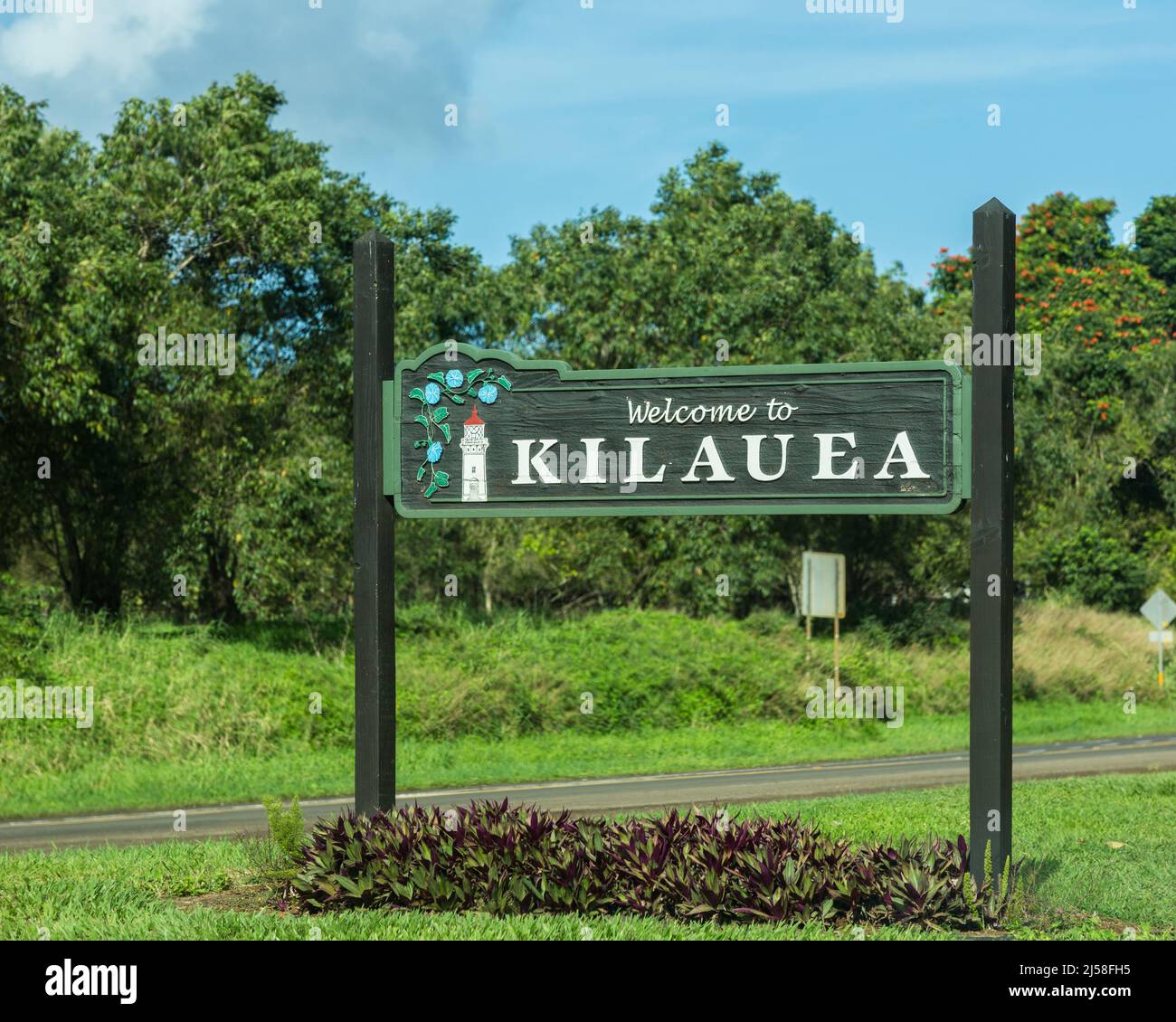 Il segno intagliato di legno accogliente per la comunità di Kilauea a Kauai, Hawaii. Foto Stock
