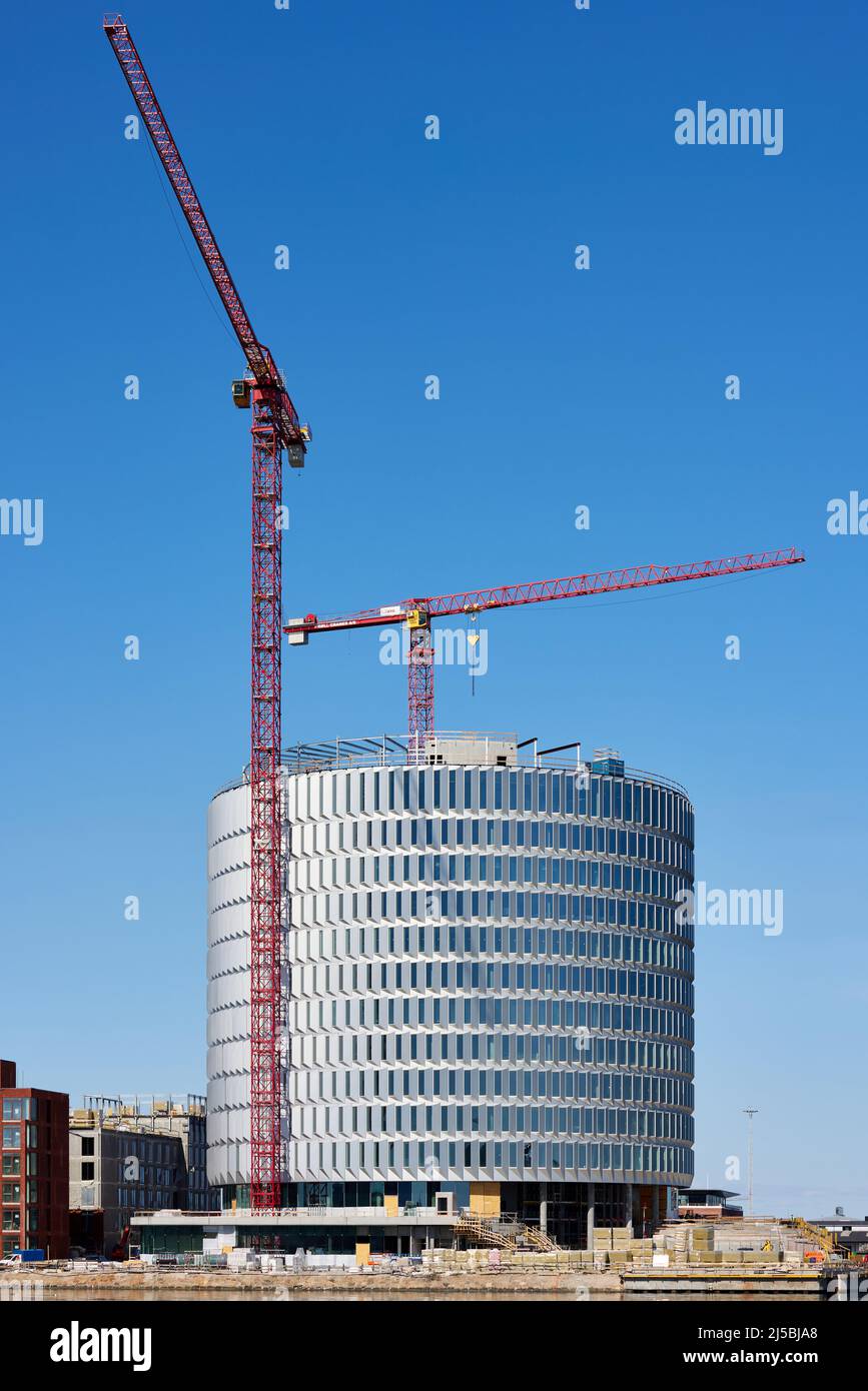 Costruzione dell'edificio circolare degli uffici 'Spidsen' a Nordø/Redmolen, Copenaghen, Danimarca Foto Stock