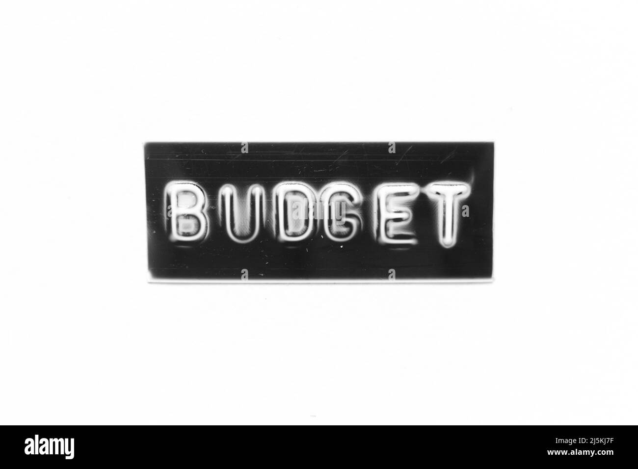 Banner di colore nero con lettera in rilievo con budget di parola su sfondo bianco Foto Stock