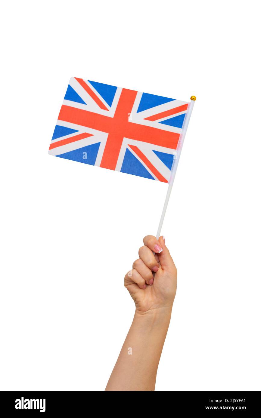 Mano femmina che tiene bandiera britannica, isolata su sfondo bianco Foto Stock