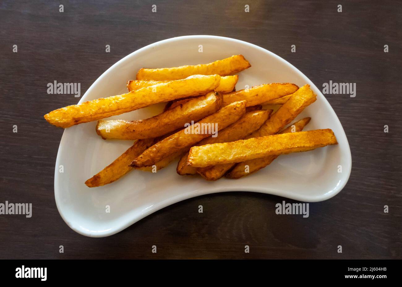 Un contorno di patate fritte francesi dorate - patatine fritte, patatine fritte Foto Stock