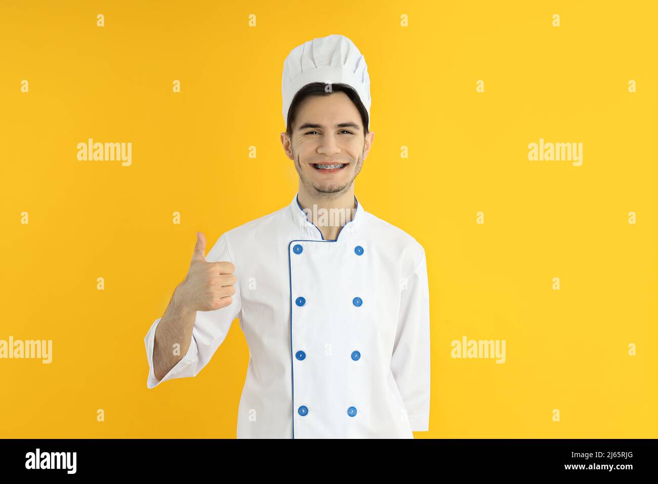Concetto di professione, giovane attraente chef maschile Foto Stock