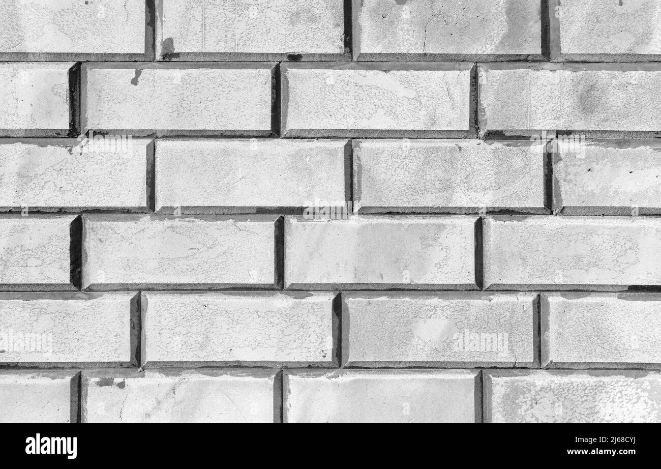 Parete in mattoni bianchi, immagine di sfondo monocromatica ravvicinata Foto Stock