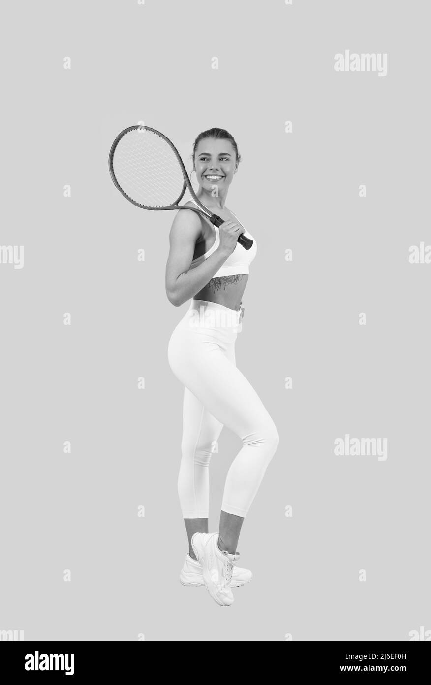 sportivo donna tennis giocatore con fit corpo in abbigliamento sportivo tenere badminton racket, sport. Foto Stock