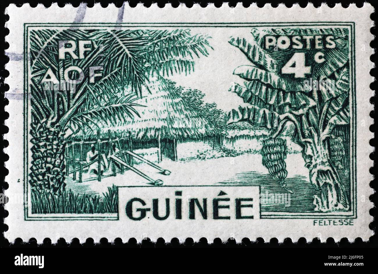 Fattoria su francobollo vintage dalla Guinea Foto Stock