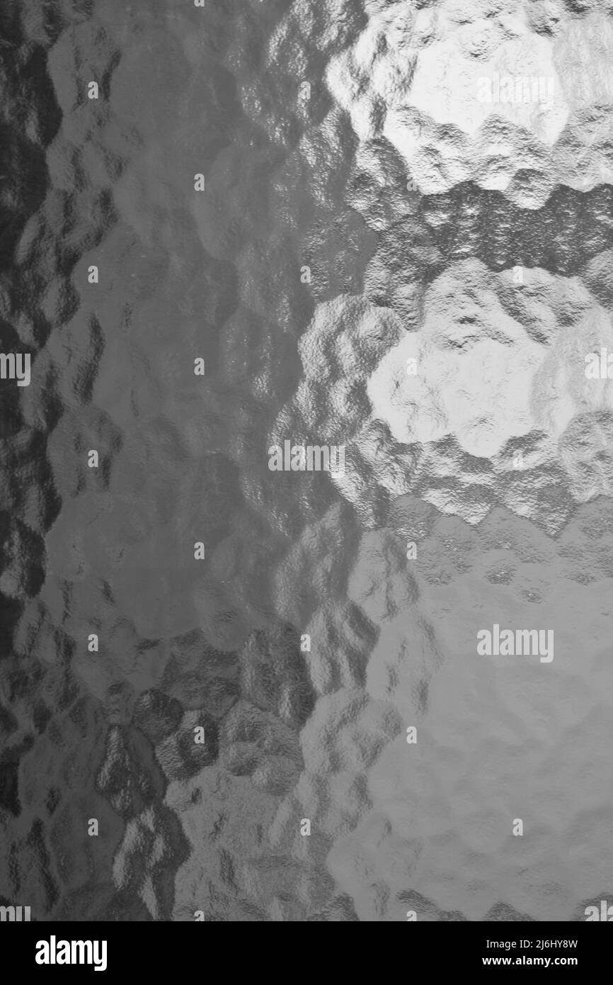 Finestra di vetro a motivi geometrici di una porta a una sala conferenze presso un'università didattica in bianco e nero. Foto Stock