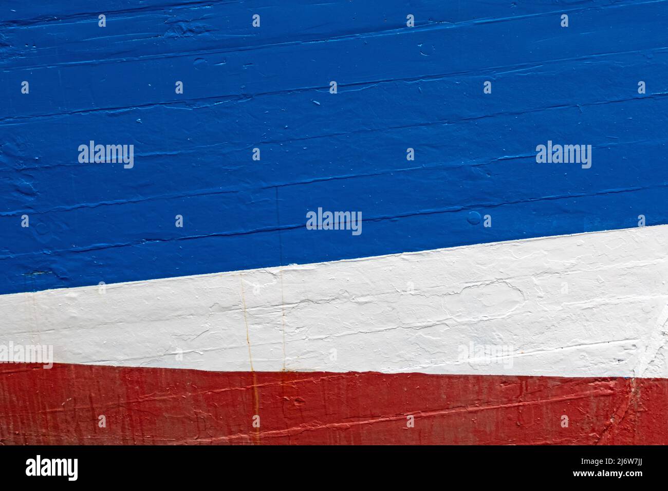 Immagine astratta dei colori dello scafo di una nave nei colori della bandiera di stato dello Schleswig-Holstein Foto Stock