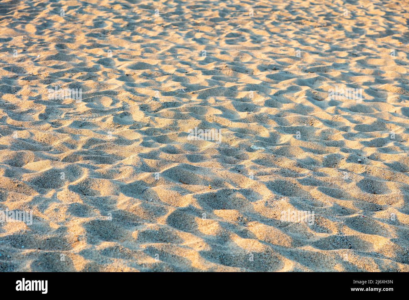 Sabbia texture sfondo. Spiaggia sabbiosa superficie ruvida. Materiale naturale sopra la vista. Concetto di vacanza estiva. Foto Stock