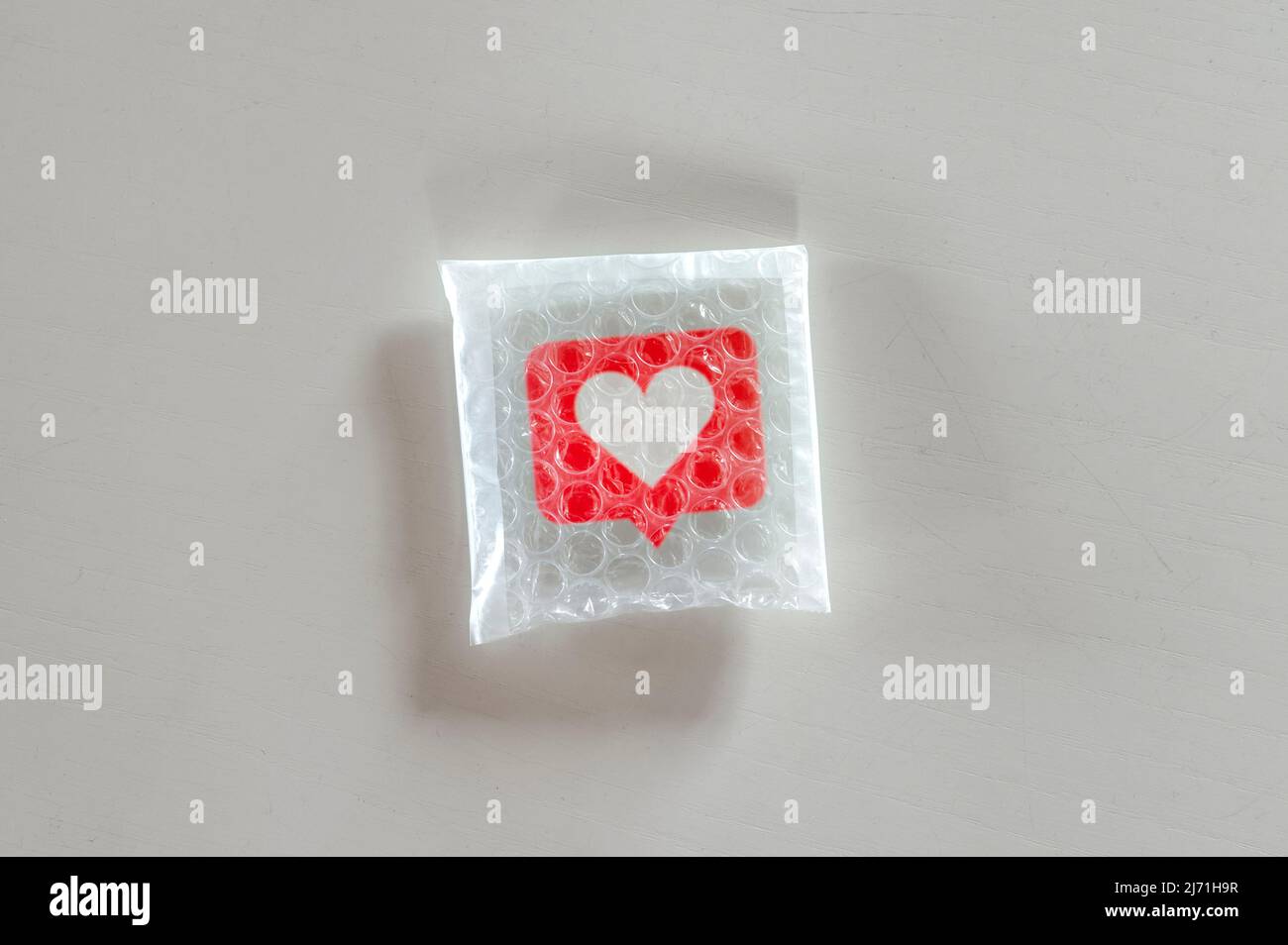 Confezionare social come icona con bolla wrap Foto Stock