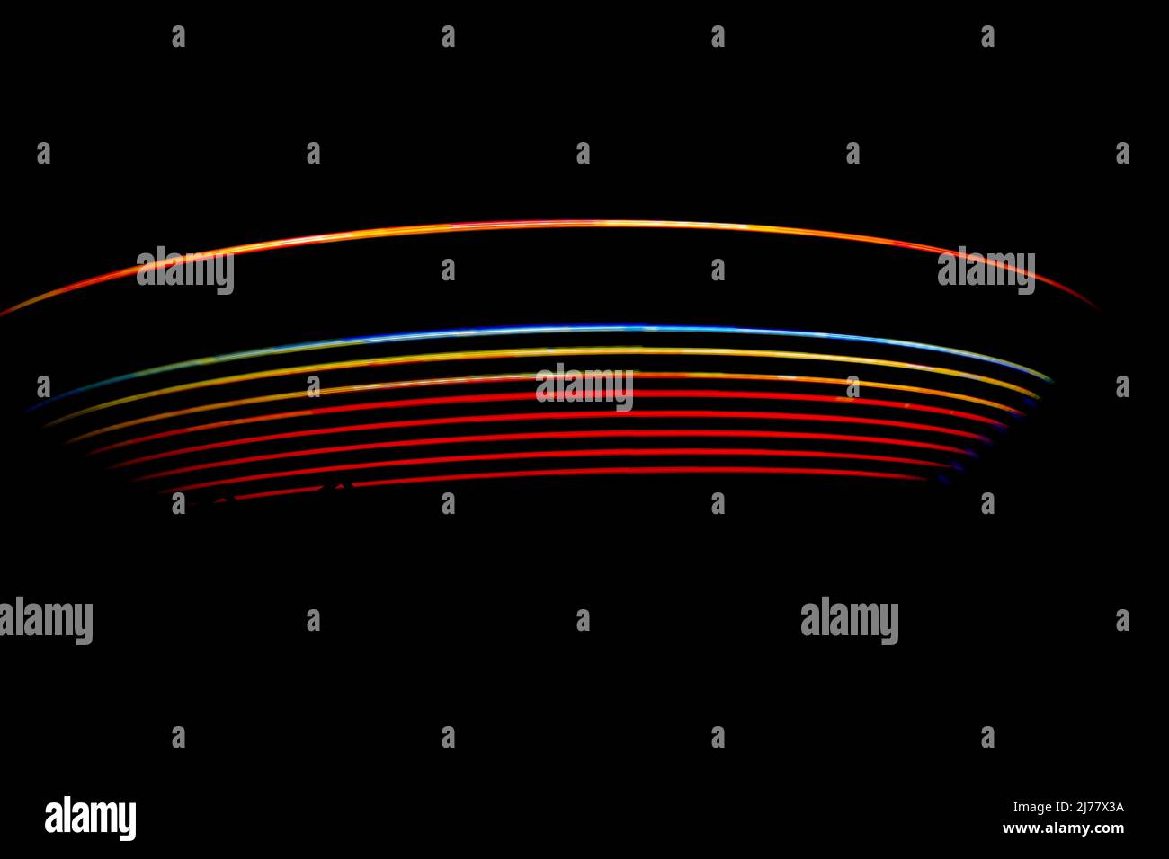 Scatti notturni selvaggi di giostre di divertimento Foto Stock