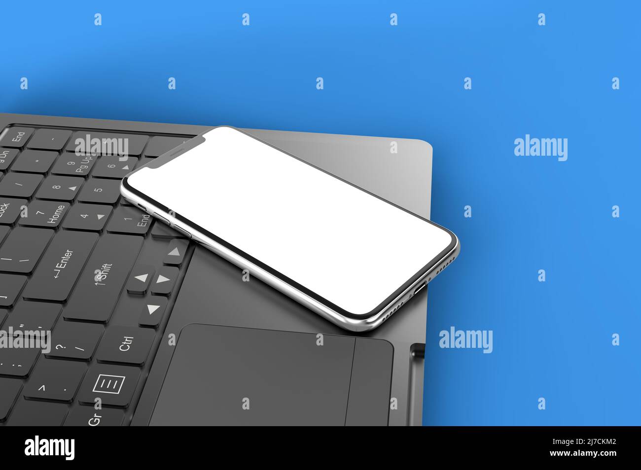 Smartphone su un computer portatile, illustrazione 3D. Foto Stock