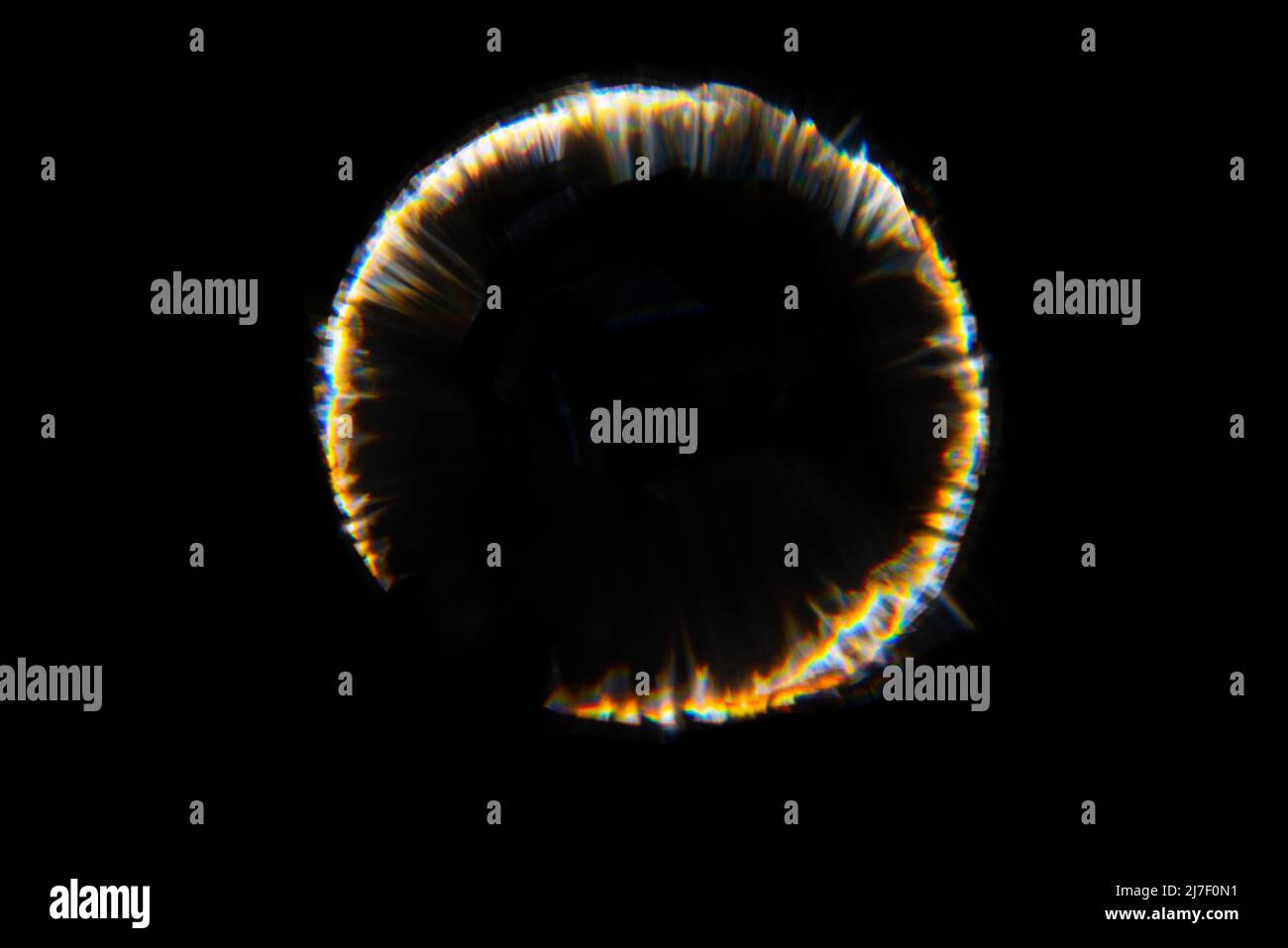 Il sole naturale astratto fioca sul nero Foto Stock