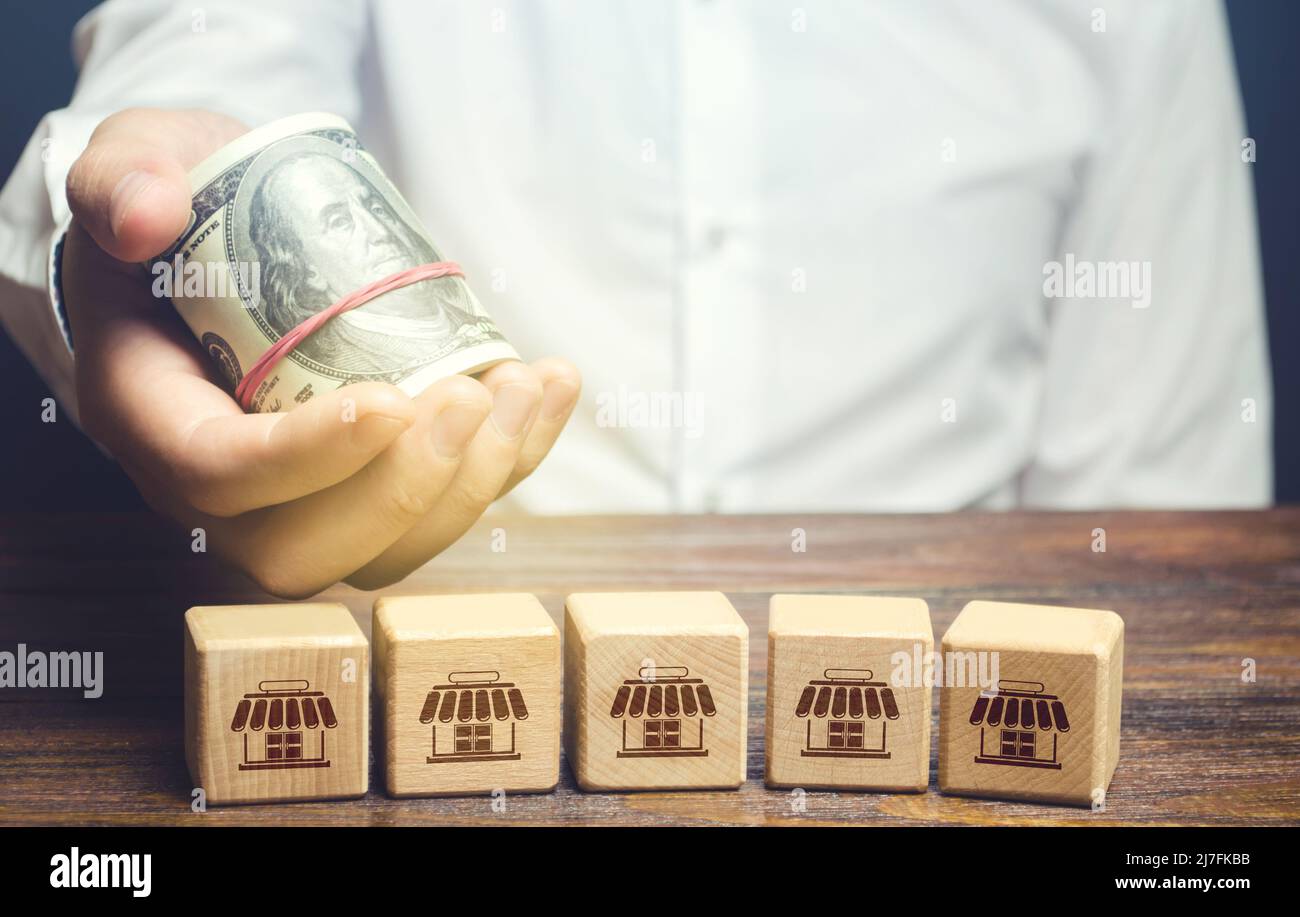 Investimenti in franchising business. Acquisto di un'azienda. Capitale autorizzato. Finanziamento e prestiti. Espansione e crescita competitiva. Profitto. Annuncio Foto Stock