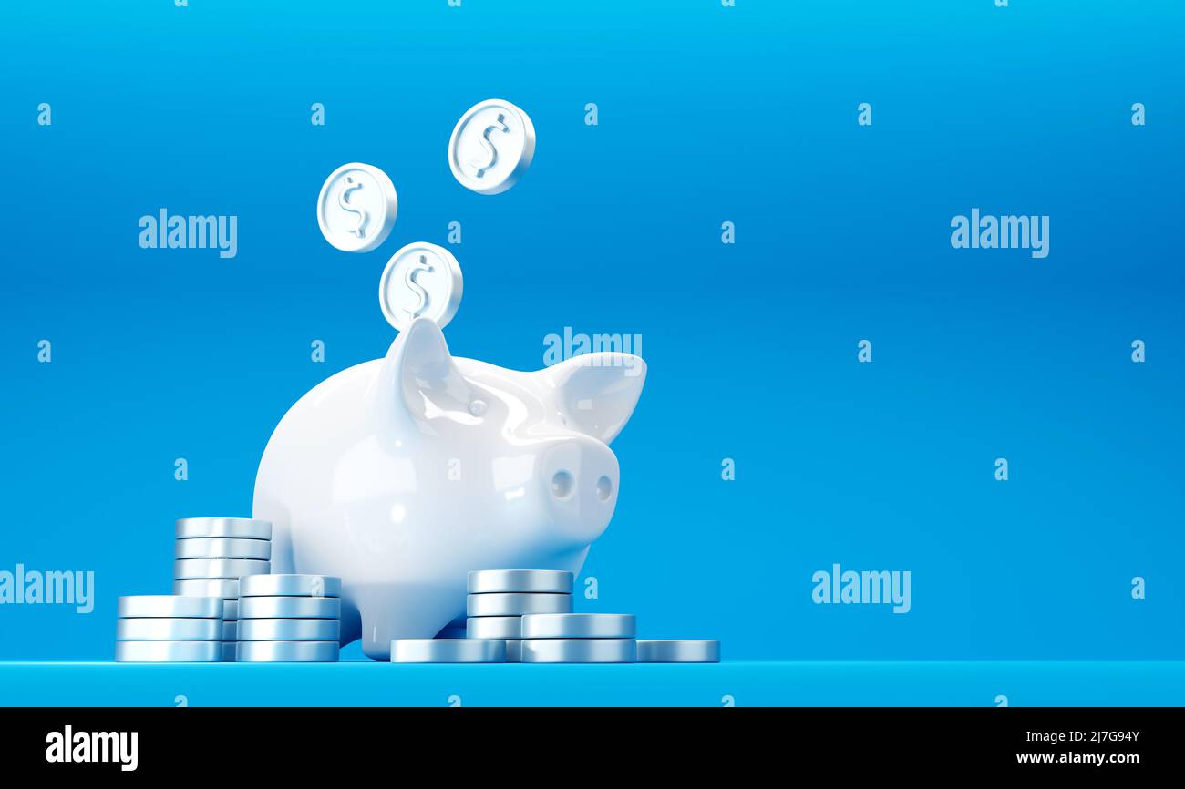 Banca bianca del piggy con le monete di dollaro d'argento cadenti ed il mucchio delle monete Foto Stock