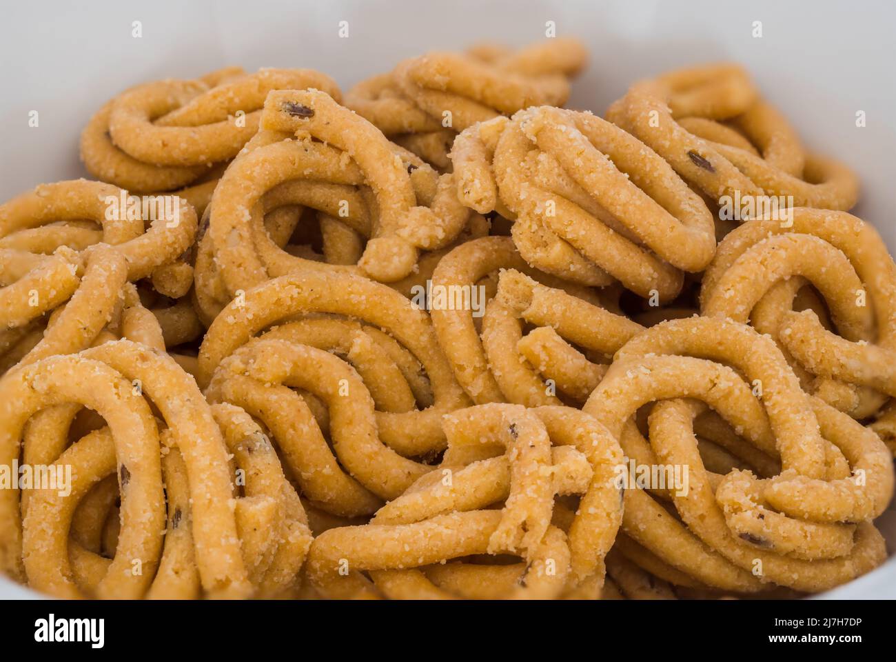 Murruku (aka Chakli) uno spuntino fritto dell'India meridionale a base di farina di riso e burro di ghee. Murruku è fatto durante i festival come Diwali, Navratri, Pongal, Foto Stock