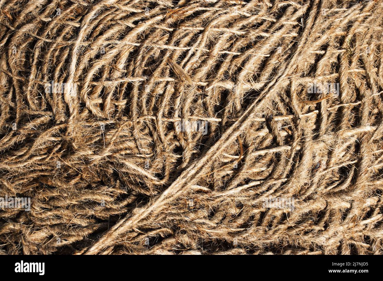 sfondo astratto o dettaglio texture su corda di lino aggrovigliata Foto Stock