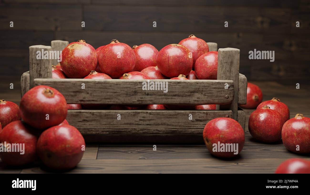 melograni, frutta succosa in una cassa su pavimento di legno Foto Stock