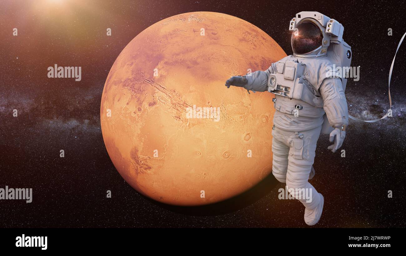 Astronauta durante la passeggiata spaziale in orbita del pianeta Marte Foto Stock