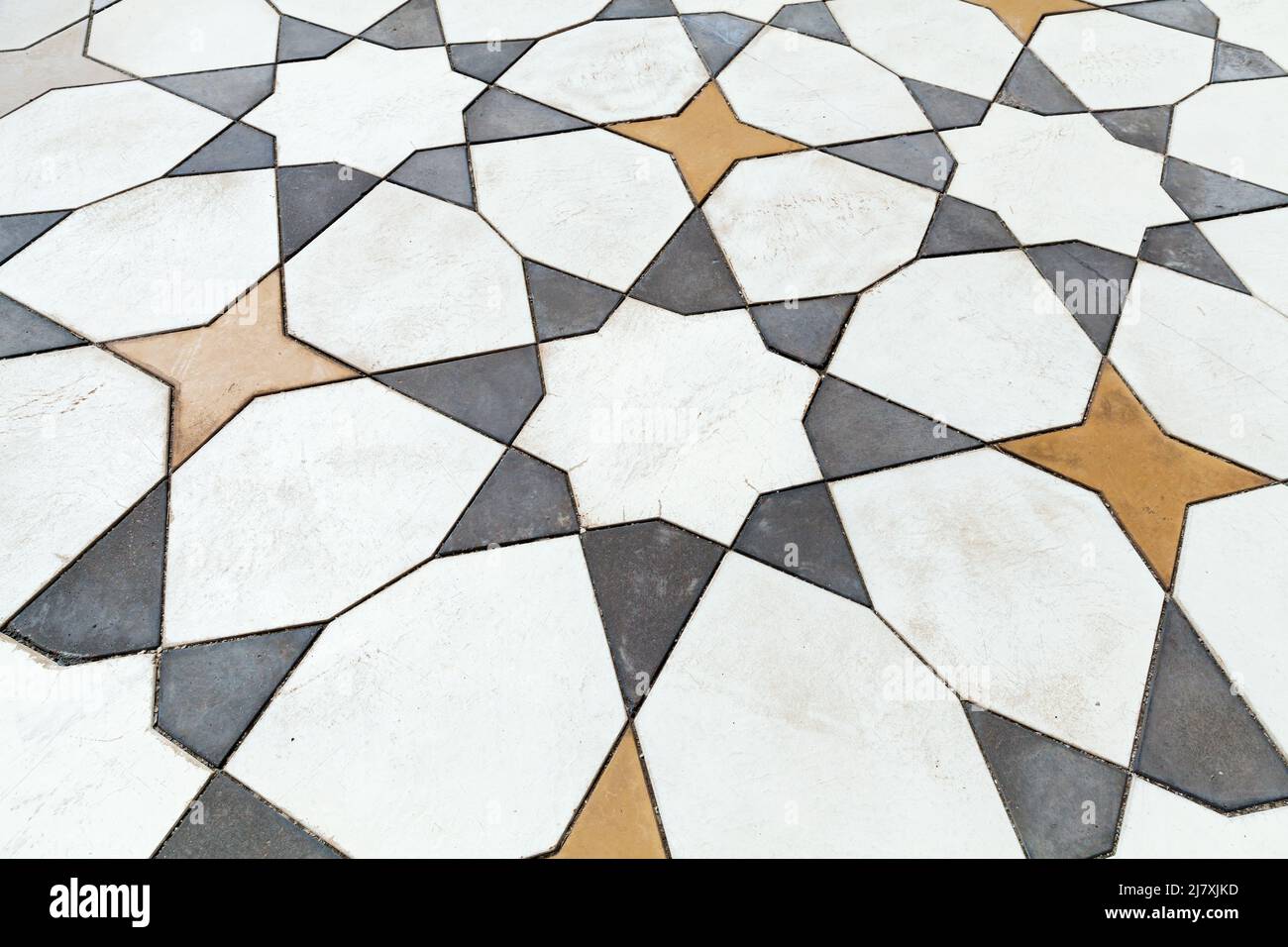 Mosaico di pietra, piastrelle di pavimento con motivo geometrico arabo, trama foto di sfondo Foto Stock