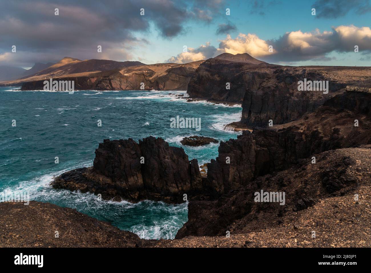 Costa rocciosa, Punta Pesebre, Fuerteventura, Isole Canarie, Spagna Foto Stock