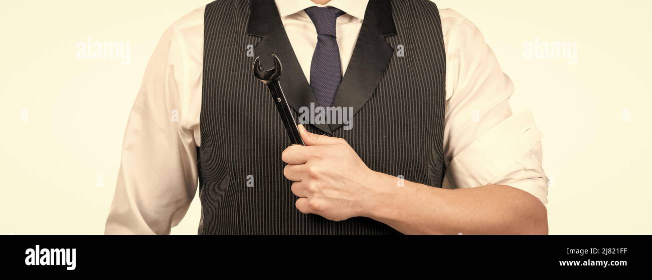 chiave a bussola per riparazioni cropped business man hold isolata su bianco, miglioramento aziendale Foto Stock