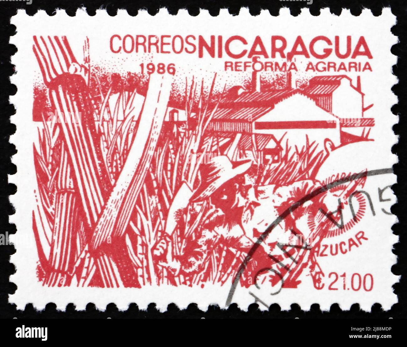 NICARAGUA - CIRCA 1986: Un francobollo stampato in Nicaragua mostra canna di zucchero, riforma agraria, circa 1986 Foto Stock