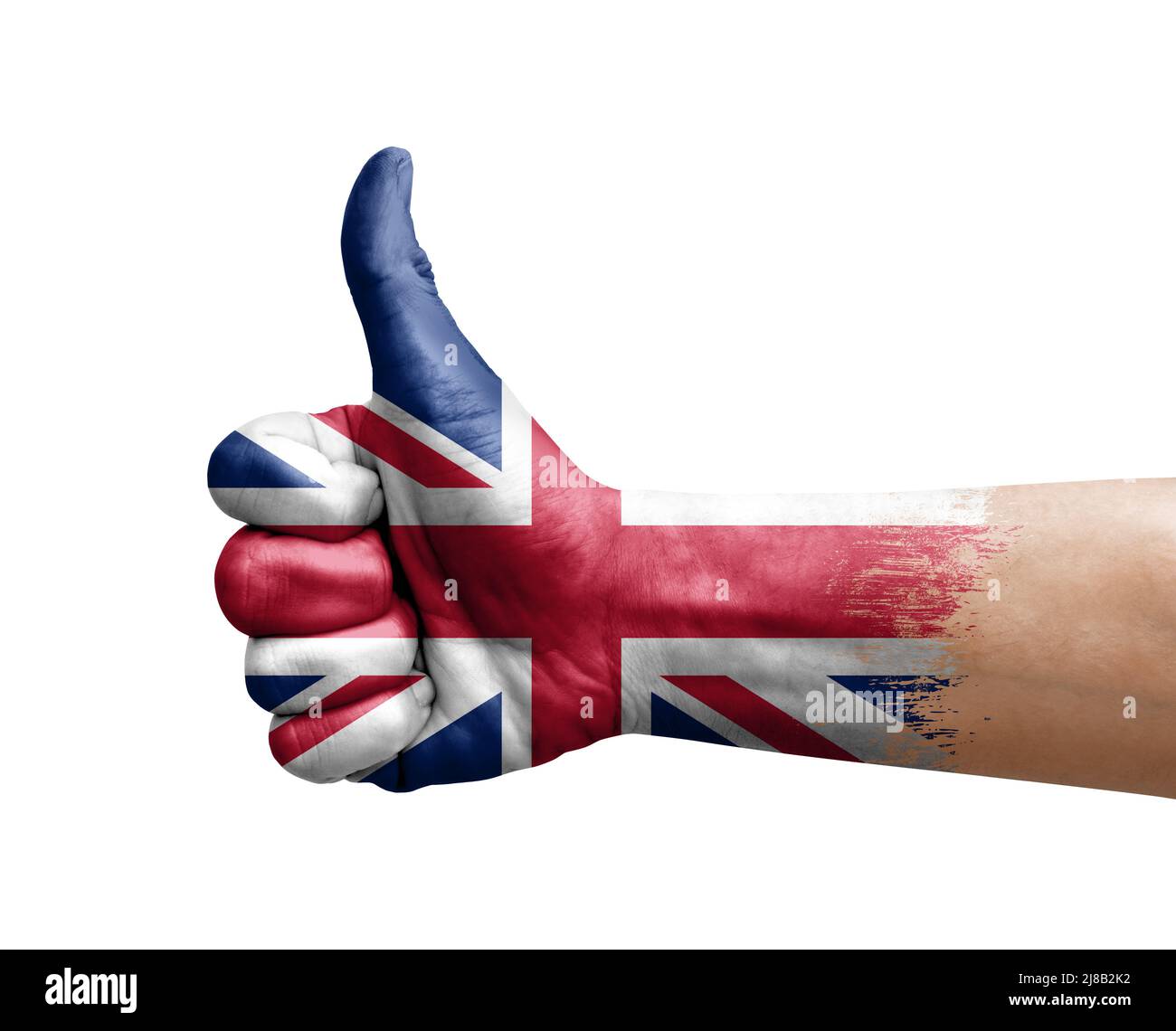 Mano facendo pollice su dipinto con bandiera del regno unito Foto Stock