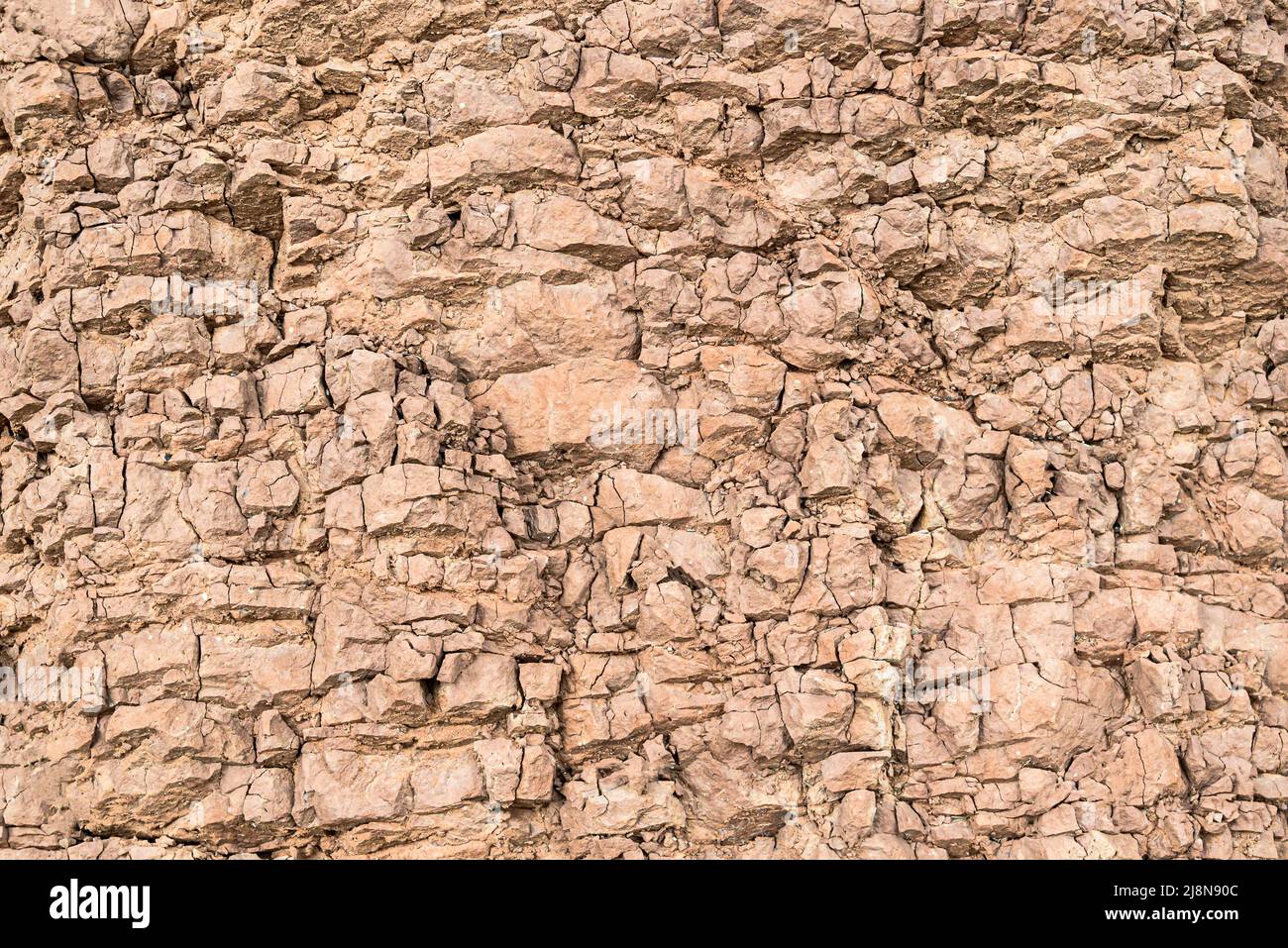 Montagna cracked terra parete sfondo. Texture, natura Foto Stock