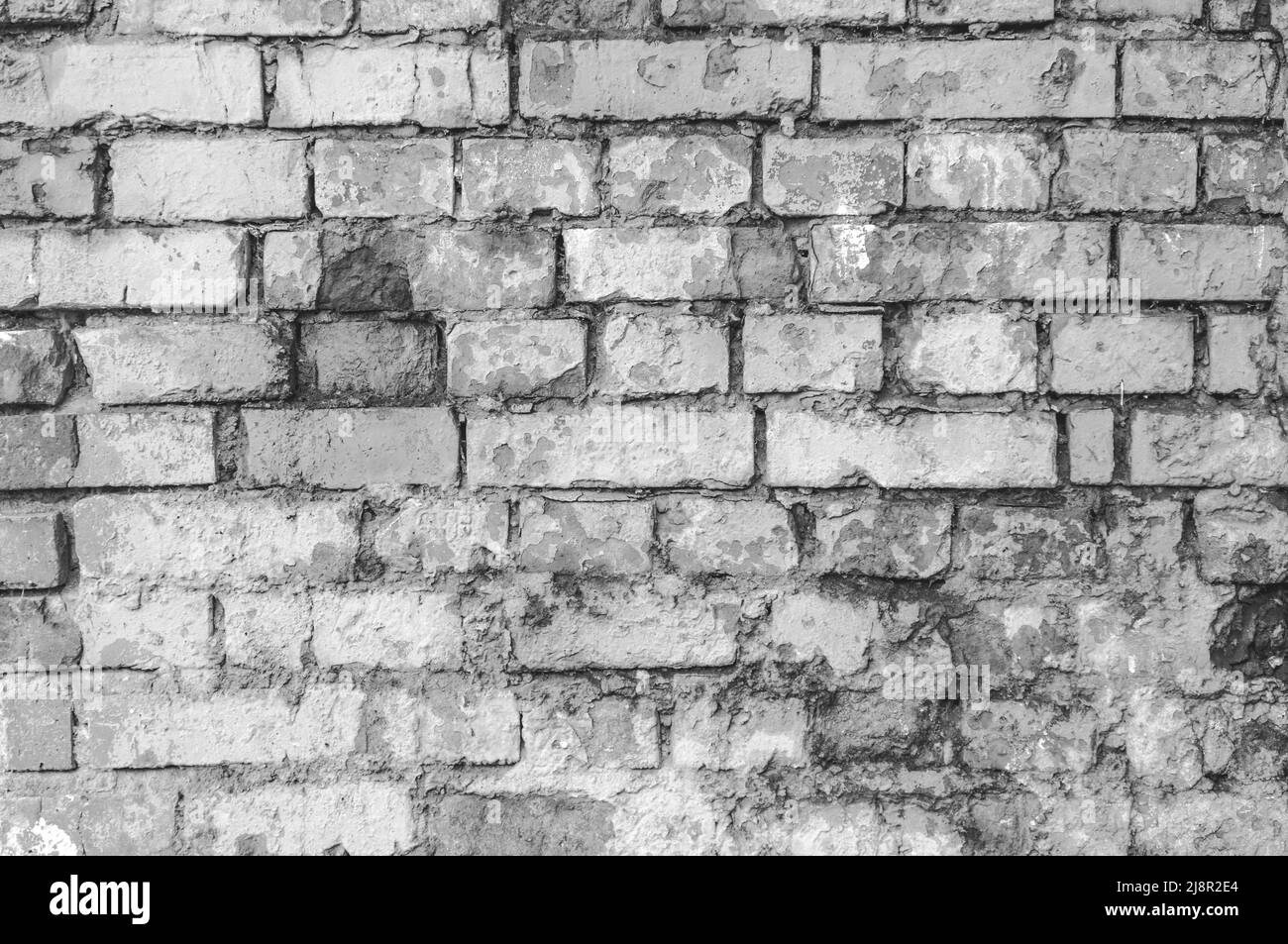Abstract weathered texture colorate vecchio stucco grigio chiaro e di età compresa la vernice bianco muro di mattoni di sfondo nella camera rurale, grungy rusty blocchi di pietra te Foto Stock