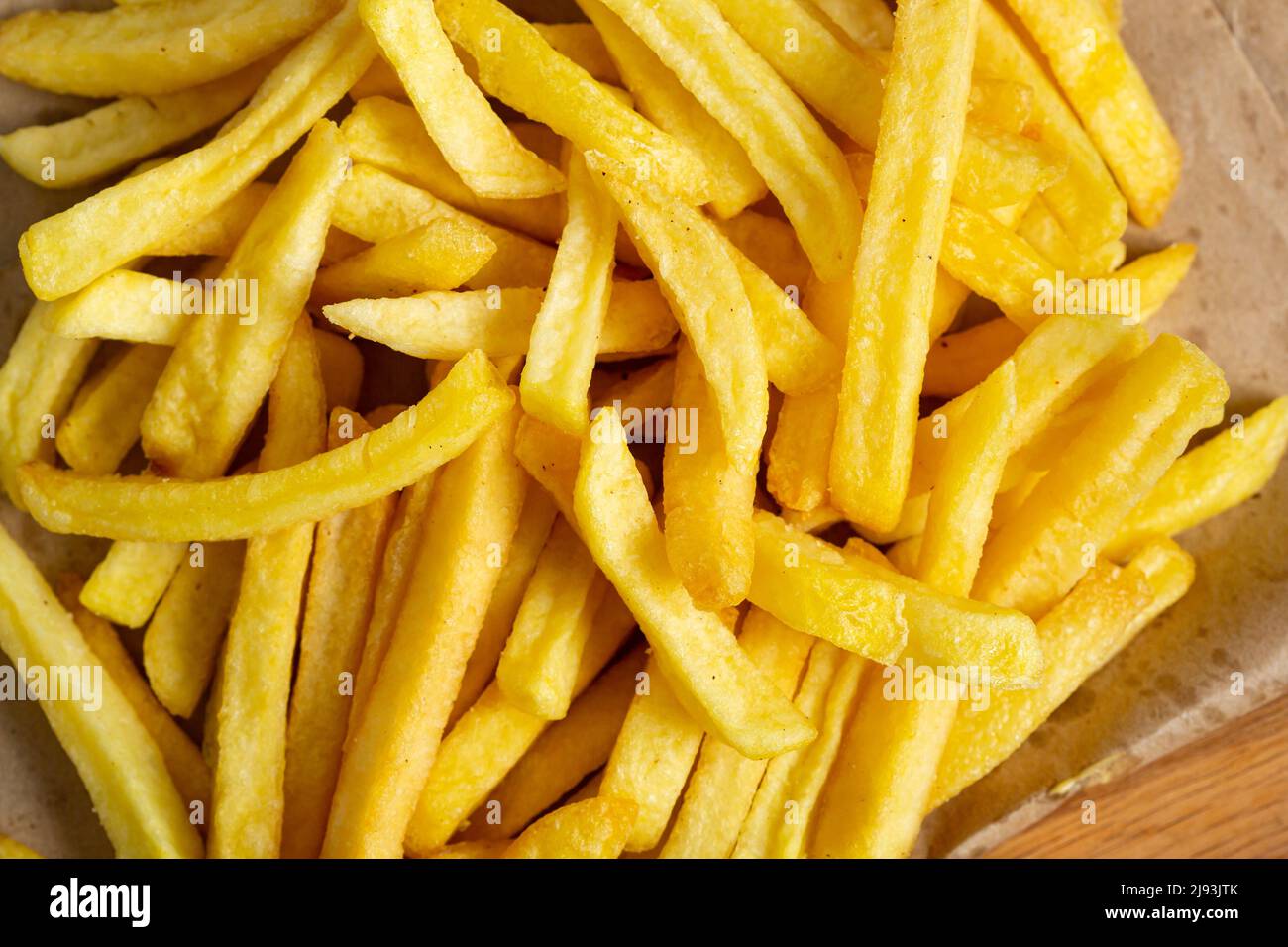 Cibo sfondo giallo patata patata patatine fritte dall'alto Foto Stock