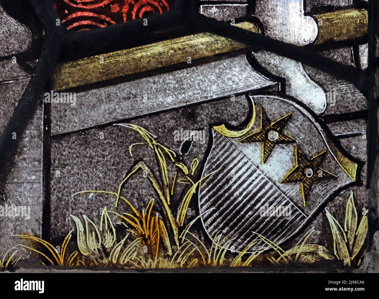 Il rebus usato da Percy Bacon & Brothers sul loro vetro colorato; lo stemma di 'Bacon' Foto Stock