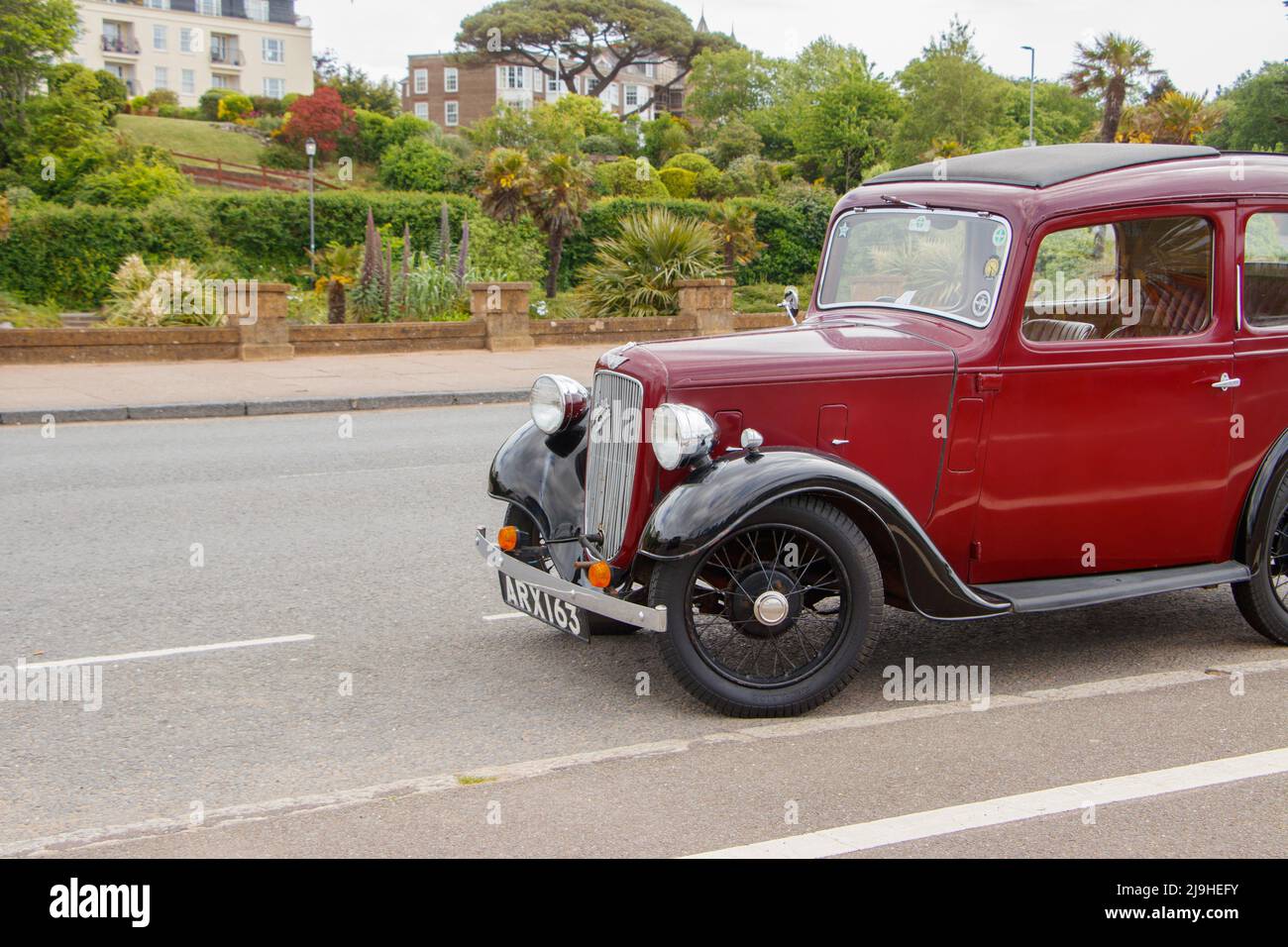 1930s Maroon d'epoca Austin Seven New Ruby in Exmouth Devon UK anche conosciuto come il Baby Austin Foto Stock