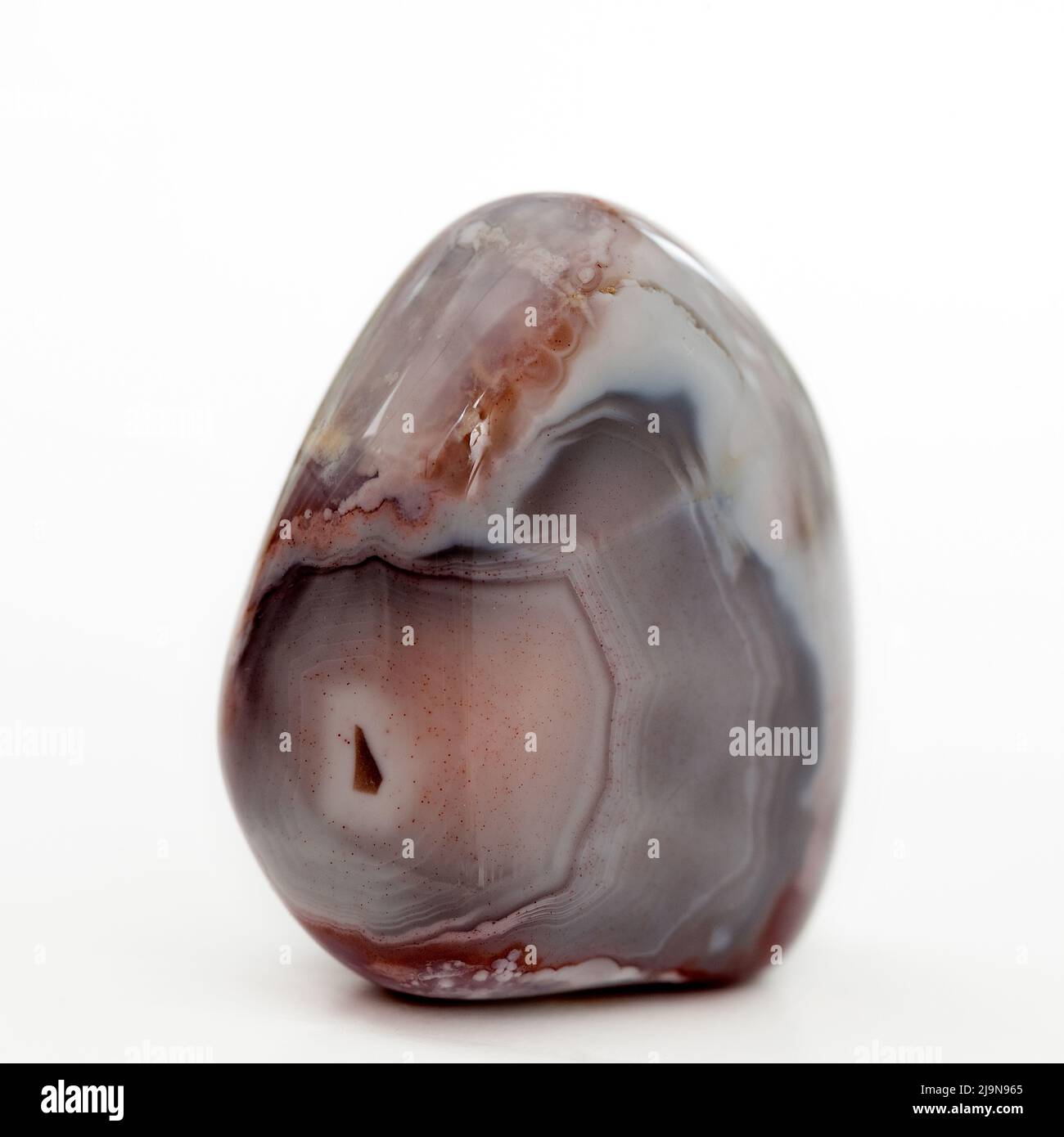 Macro primo piano Fotografia a colori di un lucido ' Botswana Agate ' una gemma di cristallo semi preziosa usata nella terapia di guarigione del cristallo Foto Stock