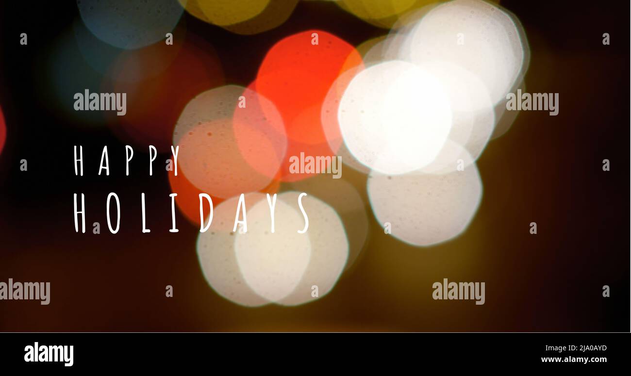 Testo Happy Holidays e luci colorate 4K Foto Stock
