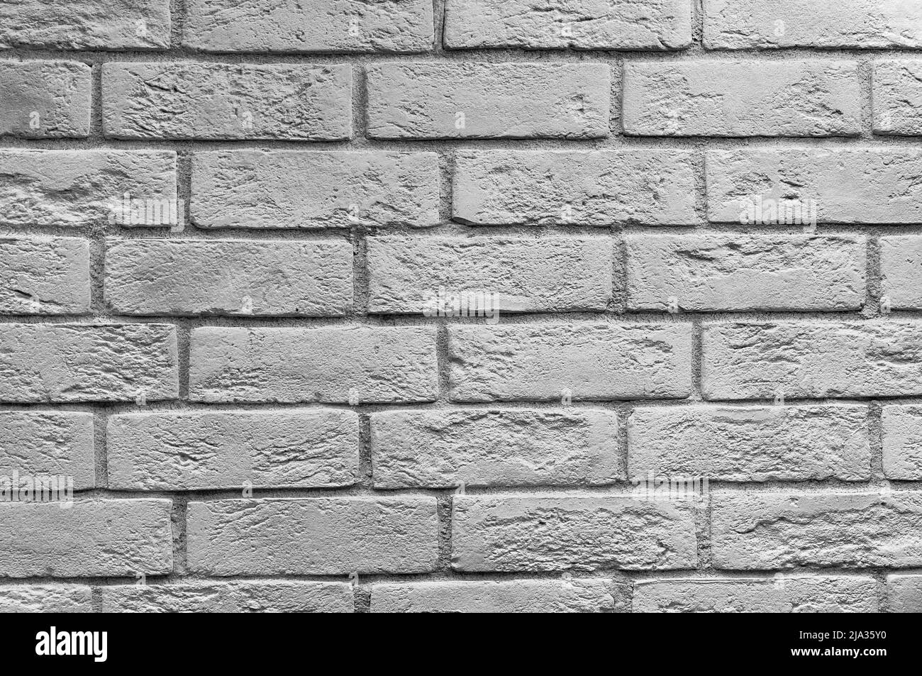 Abstract weathered texture colorate vecchio stucco grigio chiaro e di età compresa la vernice bianco muro di mattoni di sfondo nella camera rurale, grungy rusty blocchi di pietra te Foto Stock
