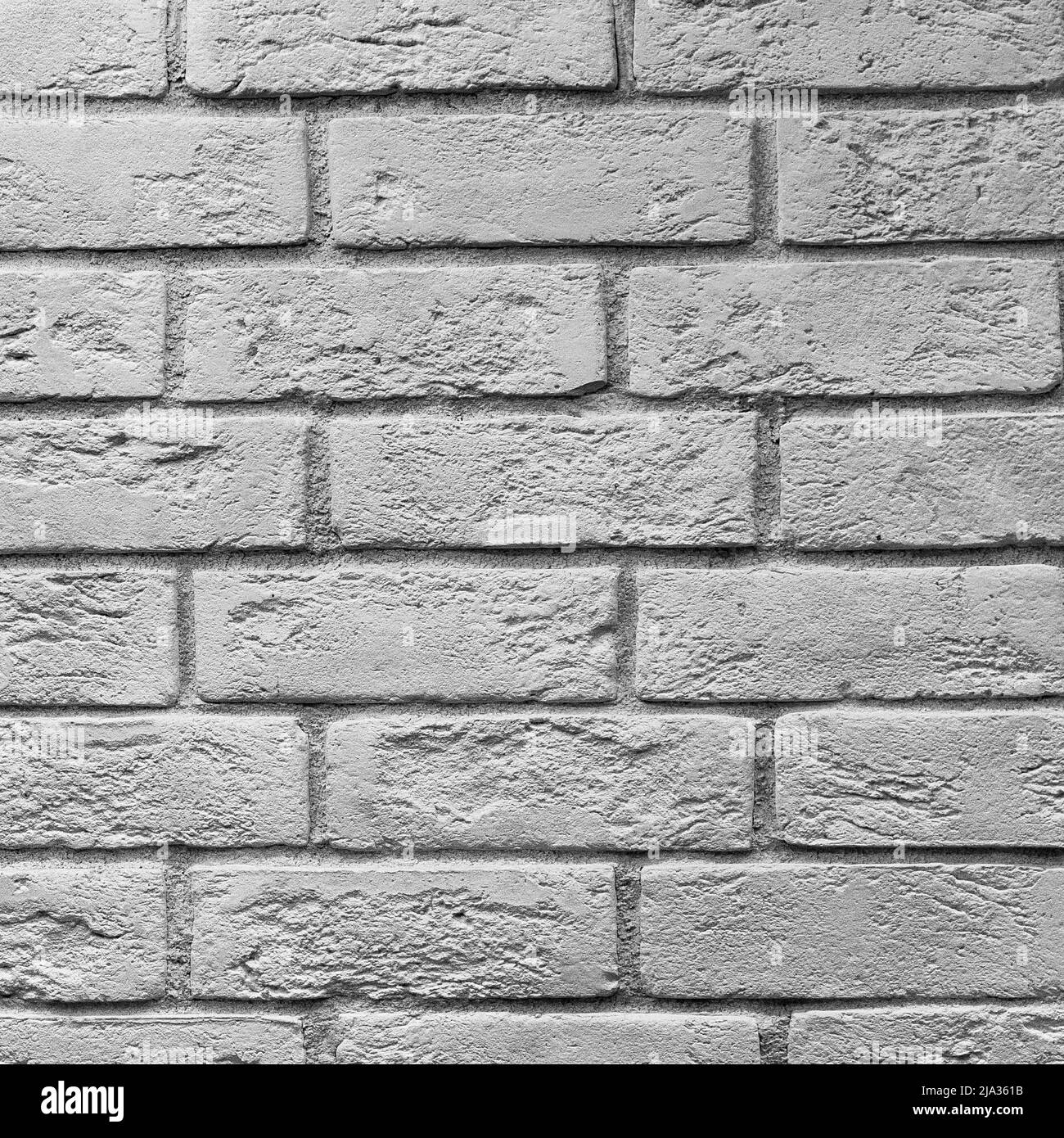 Abstract weathered texture colorate vecchio stucco grigio chiaro e di età compresa la vernice bianco muro di mattoni di sfondo nella camera rurale, grungy rusty blocchi di pietra te Foto Stock