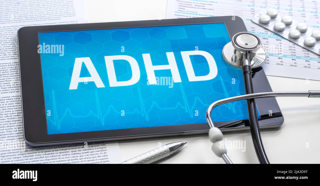 La parola ADHD sul display di un tablet Foto Stock