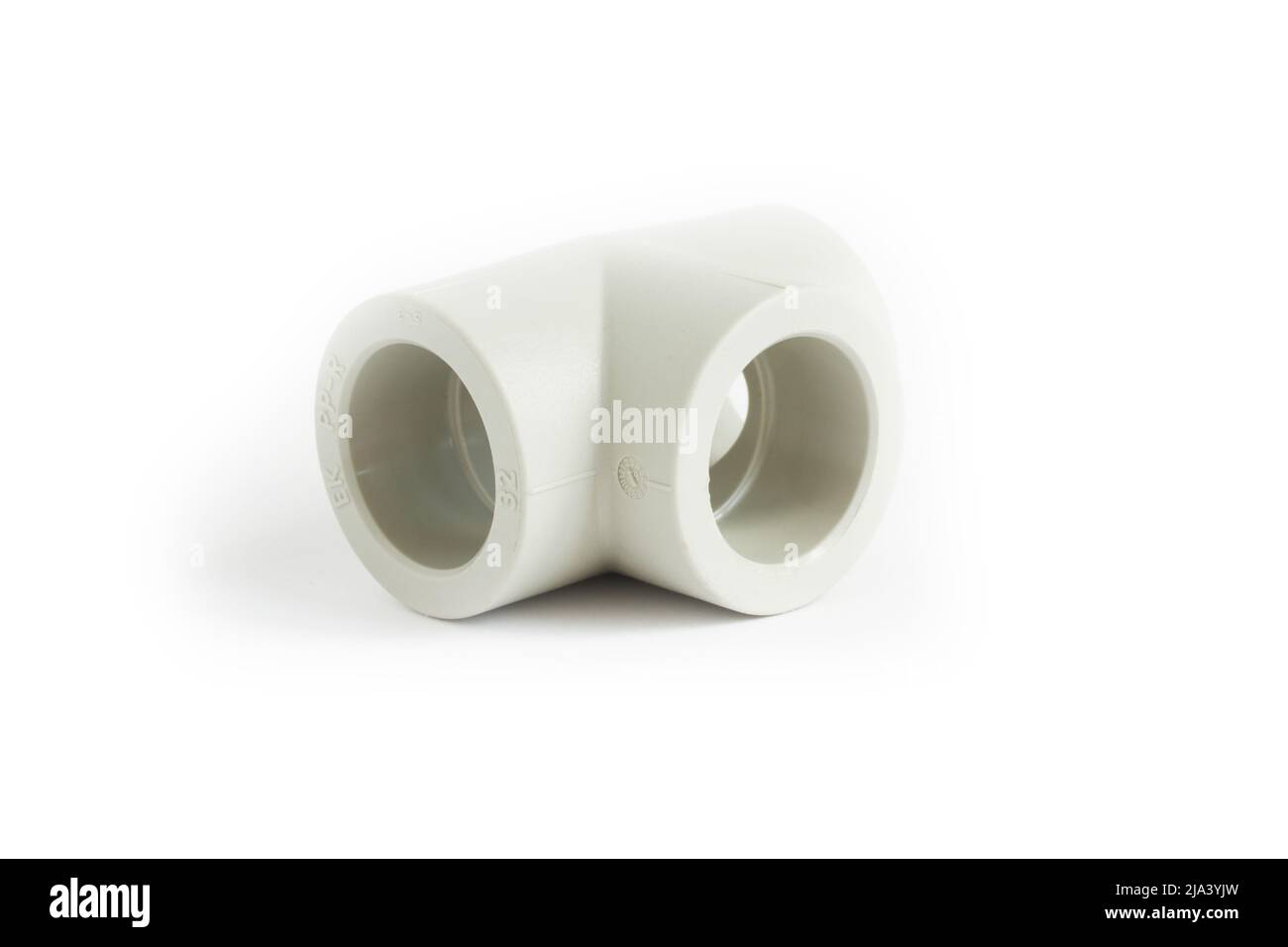 Valvola per impianto idraulico isolata su sfondo bianco. Materiale - plastica. Primo piano Foto Stock