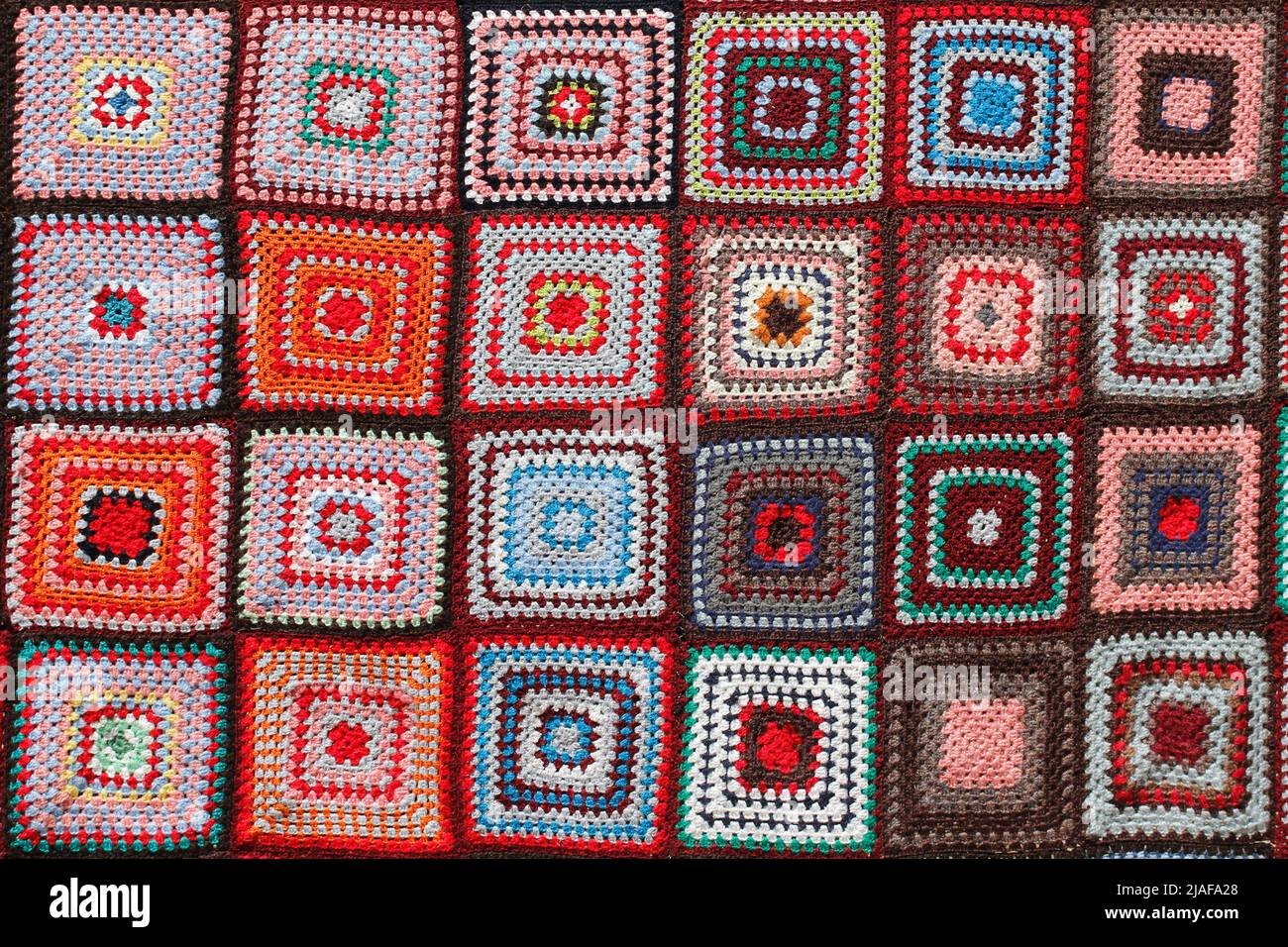 Dettaglio di una coperta di lana multicolore a mosaico. Foto Stock