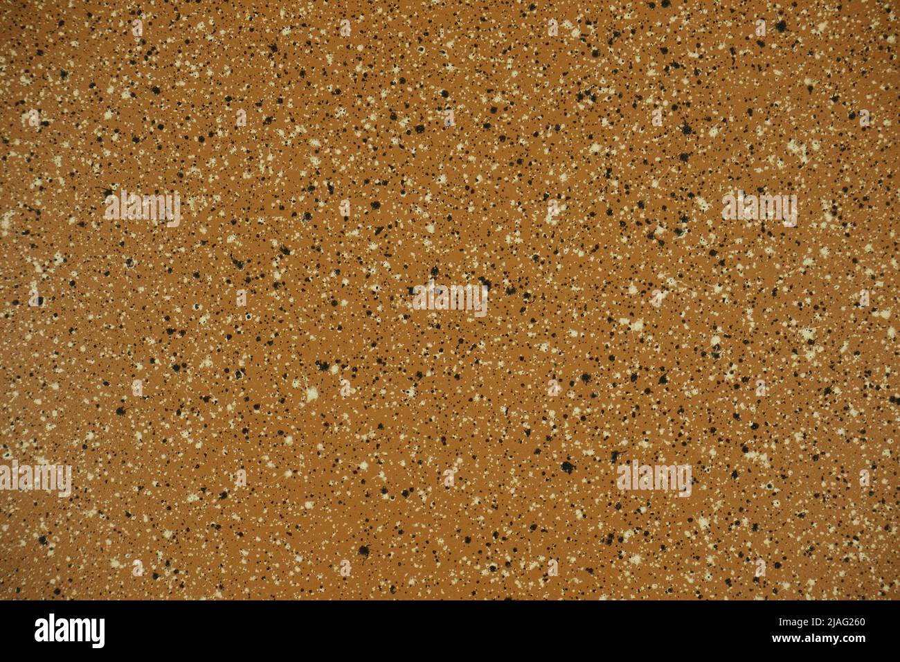 texture di granito marrone lucido con spruzzi bianchi e neri Foto Stock