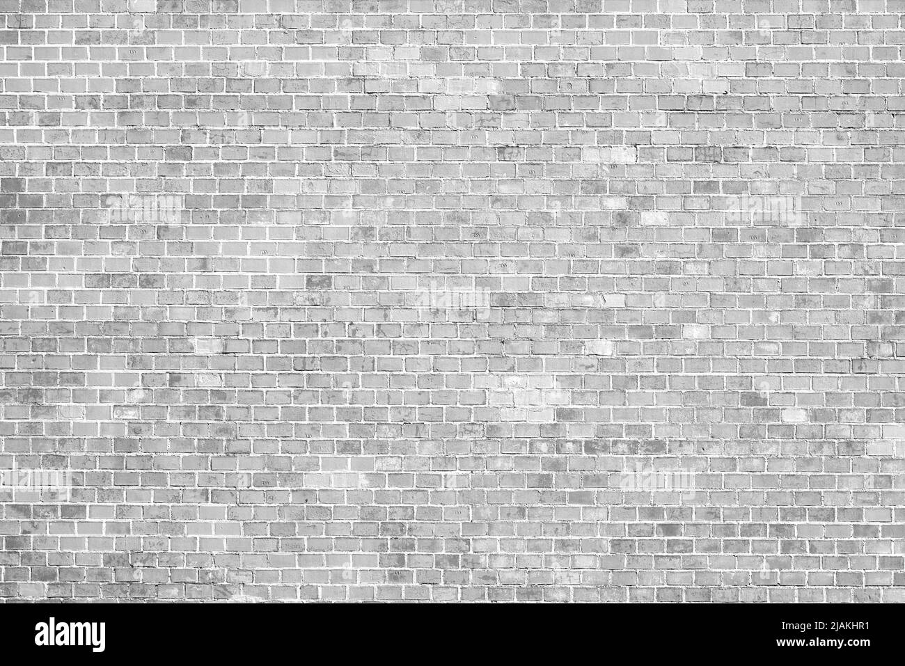 Vecchio muro di mattoni bianchi. Un'antica fortezza. Edificio medievale in mattoni rossi. Texture di sfondo grande parete di mattone. Foto Stock