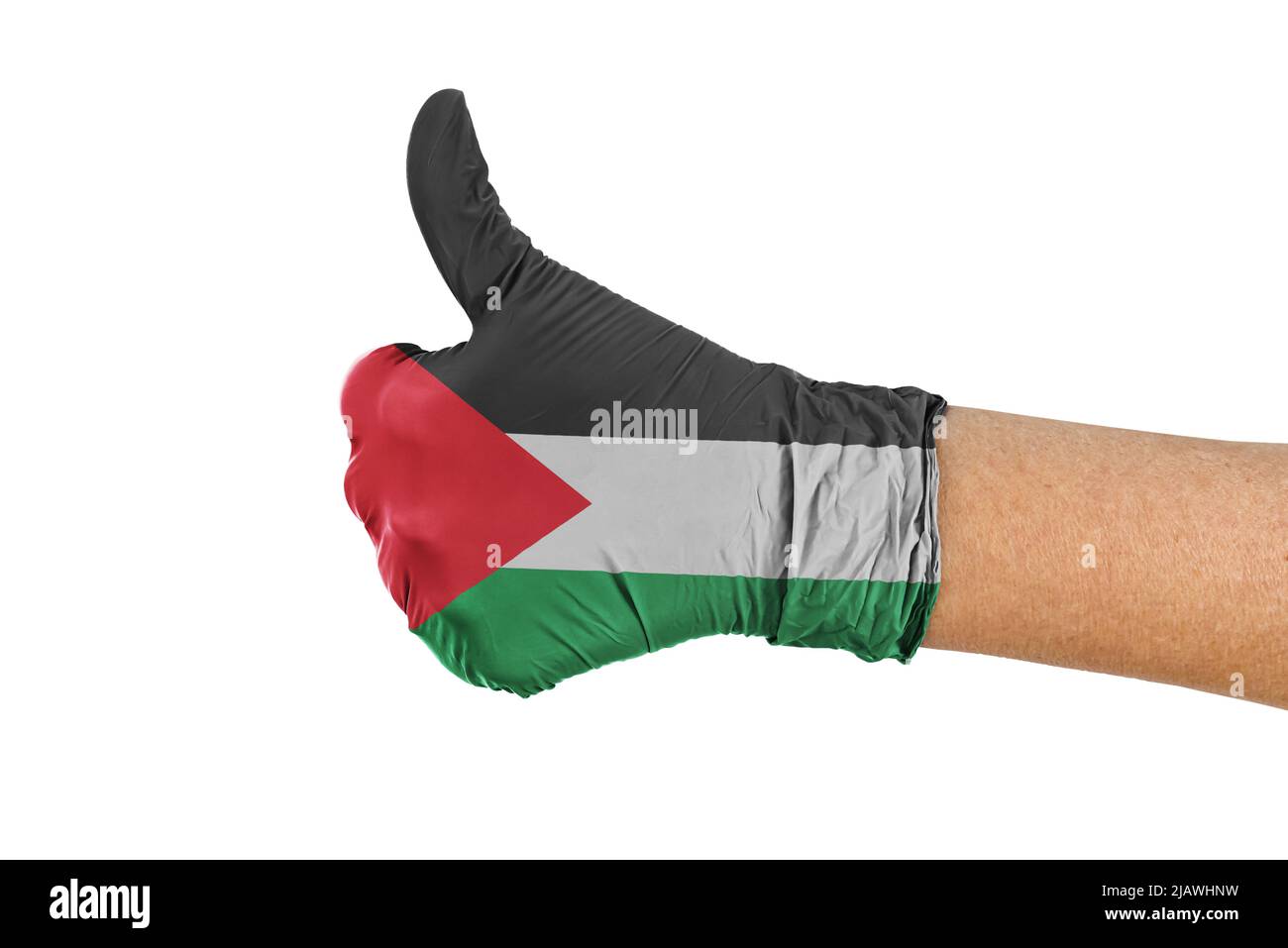 Bandiera del paese palestinese su un guanto che mostra i pollici segno in su Foto Stock