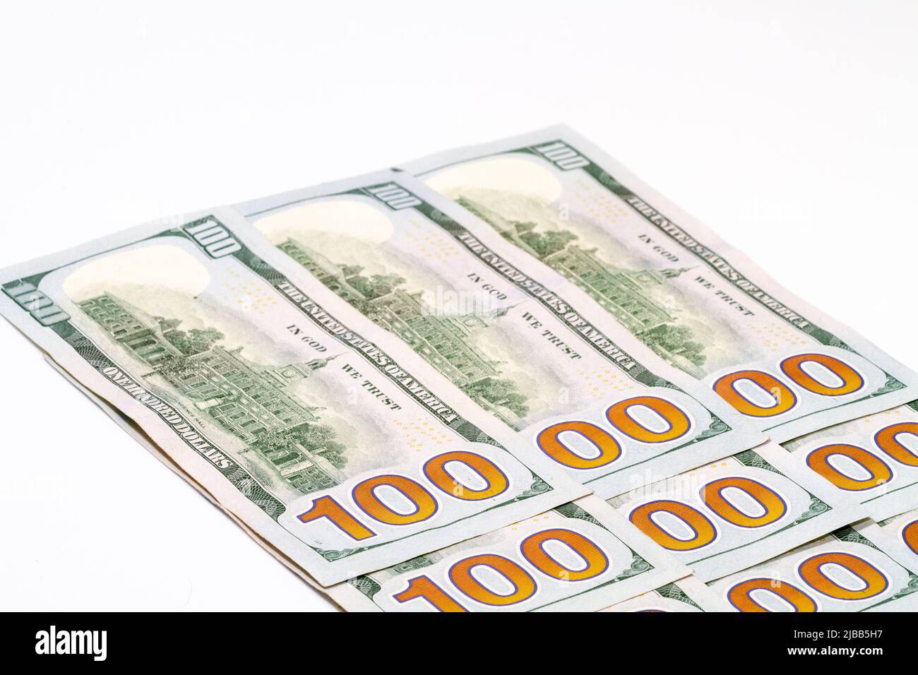 Angolati uno e zeri sul retro di un mazzo di Stati Uniti d'America cento dollari banconote in valuta. Con lo spazio di copia in alto a sinistra. Foto Stock