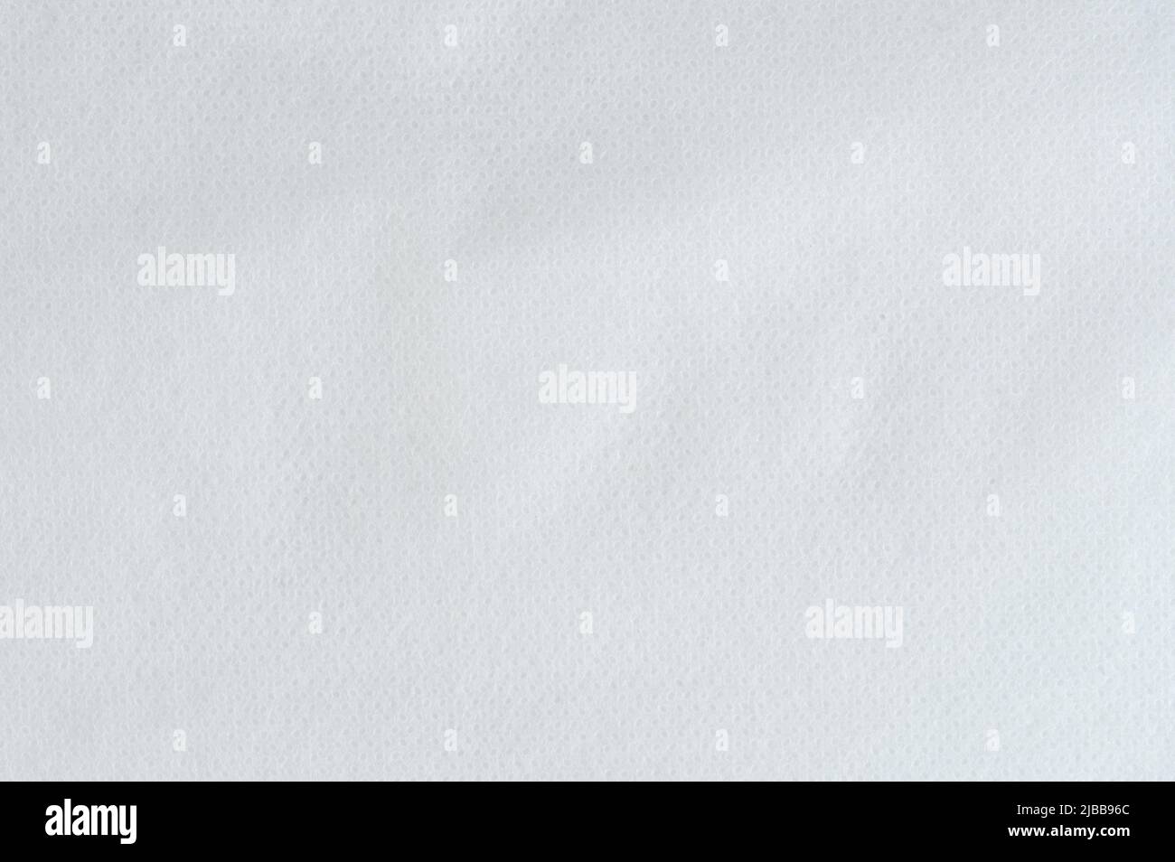 Sfondo tessuto bianco perforato superficie sfondo vista ravvicinata Foto Stock