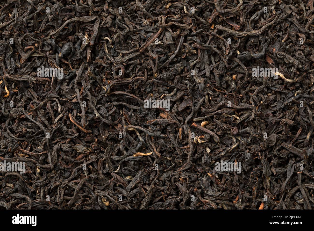 Mucchio di tè indiano Assam full frame come sfondo primo piano Foto Stock
