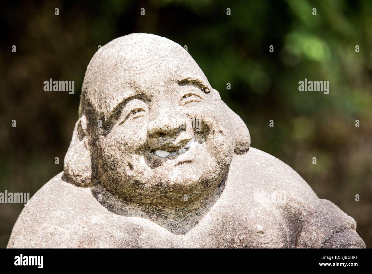 Jizo (Burai / Hotei) di scultore sconosciuto sulla strada, Nagoya, Giappone. In Giappone, ci sono molte vecchie statue di Gizo che sono state fatte in lunghe epoche fa. Foto Stock