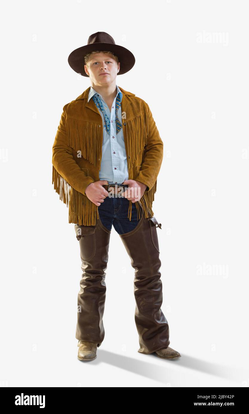 Cowboy maschio con le mani sulla cintura guardando la macchina fotografica  con espressione seria, su uno sfondo bianco Foto stock - Alamy