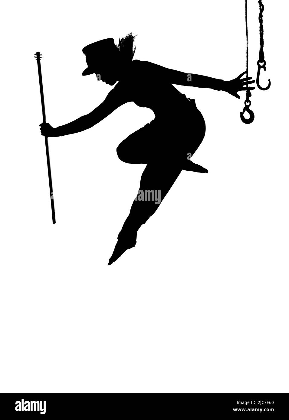 Una ballerina femminile è visto ballare sul palco. Vestita con abiti da uomo e con un cappello da uomo, si vede saltare a mezz'aria come una silhouette. Foto Stock
