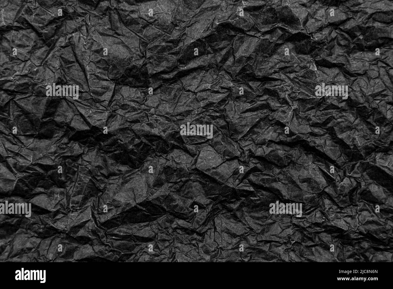 Trama di carta nera grattata. Sfondo da vecchia carta scura Foto Stock
